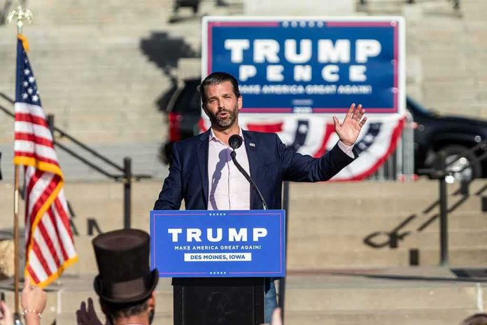 shutterstock_1833067315 man speaking at a political rally podium