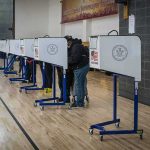 1,000 Feds Invade Polls Voters at polling booths in a gymnasium