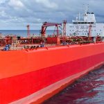Red oil tanker ship at sea