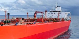 Red oil tanker ship at sea