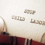 Typewriter typing the words stop child labor