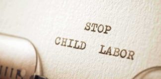 Typewriter typing the words stop child labor