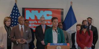Millions Pour Into NY Governor Race Speaker at podium during a press conference with officials
