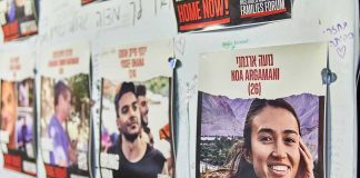 Millions Watch as Family Pleads for Answers Posters of missing people on a wall