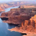 NYC Mom Slashed on Havasu Falls Trail Red sandstone cliffs by a winding blue lake