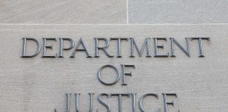Campaigns, Mortgages… With COVID Money? Department of Justice inscription on stone wall