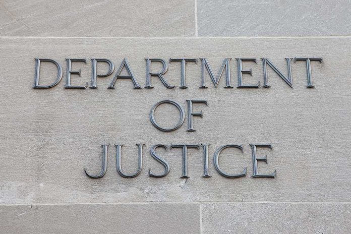 Department of Justice inscription on stone wall