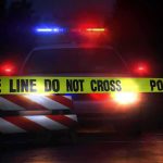Swiss Rave Shooting Leaves One Dead, Five Wounded Police car behind crime scene tape at night