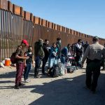 Border Patrol Comes to Media Crew’s Rescue Border patrol agents interact with a group of people.