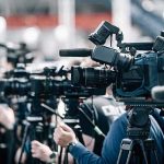 New Support Ship Could Help China Keep Warships at Sea Longer Broadcast cameras on tripods at a press event
