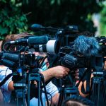 Spain Won the World Cup. Trump Stole the Spotlight. TV news cameras crowding together at an outdoor event