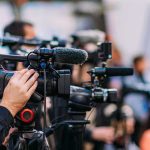 6 Million Barrels, One Day: Iran Moves Fast as Ceasefire Hangs in the Balance Video cameras on tripods at a media event