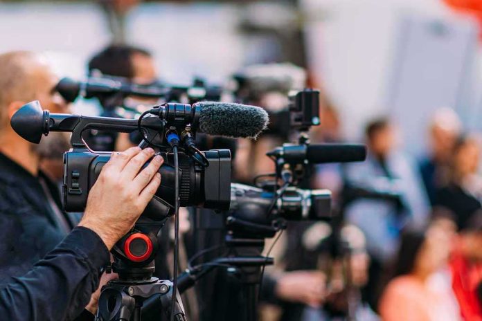 default-hero-04-3 Video cameras on tripods at a media event