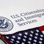 Viral Haitian Deportee Sent Back to Haiti U.S. Citizenship and Immigration Services document with American flag