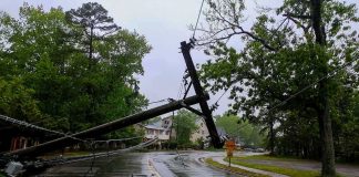 Long Beach Declares Emergency Ahead of Polo Fallen utility poles blocking a wet suburban street