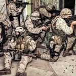 U.S. Troops Killed in Kuwait Strike soldiers in camouflage gear take positions inside a damaged building