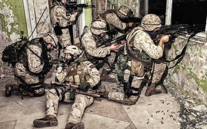 shutterstock_1163417059-1 soldiers in camouflage gear take positions inside a damaged building