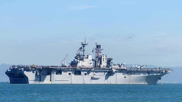 Aircraft carrier sailing on calm blue water