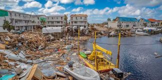 Coastal town marina destroyed by storm with debris and damaged boats