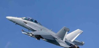 F-15E Downed Over Iran, Airmen Rescued Twin-engine fighter jet climbing in a clear blue sky