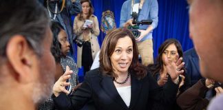 Michigan Senate Race Gets National Attention Kamala Harris speaks to a crowd as Maya Harris stands nearby