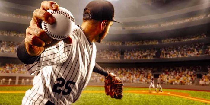shutterstock_1455281756 Baseball pitcher winding up to throw in a packed stadium
