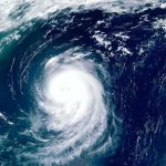Alert: Dangerous Weather Ahead Satellite view of a powerful hurricane swirling over the ocean