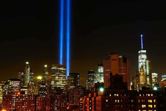 shutterstock_1495332722-1 New York City skyline at night with twin blue light beams