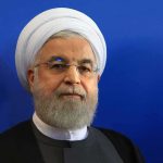 Deal or Pause Button?: U.S.-Iran Agreement Kicks the Hard Questions Hassan Rouhani portrait against a blue background