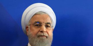 Hassan Rouhani portrait against a blue background
