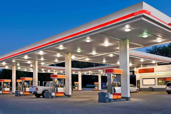 shutterstock_1615487692 gas station canopy with multiple fuel pumps at dusk