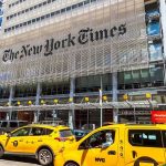 Judge Blocks NYC Rideshare Deactivation Law New York Times building with yellow taxis in front