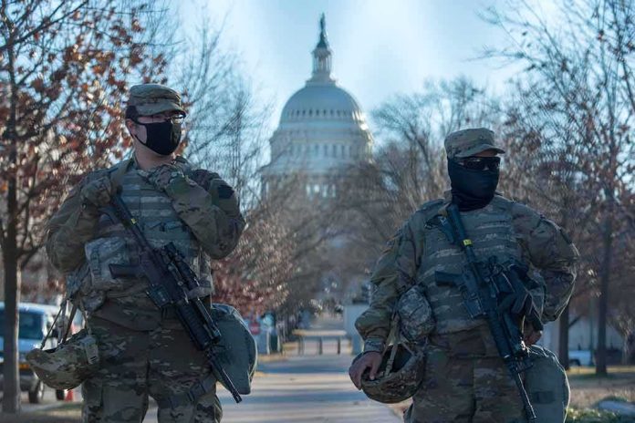 shutterstock_1898072065 Two armed soldiers stand guard near a domed government building
