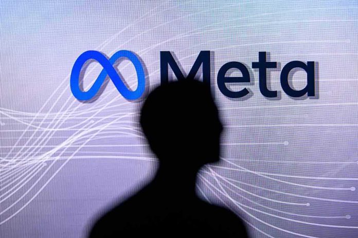 shutterstock_2131093184 silhouette in front of Meta logo on screen
