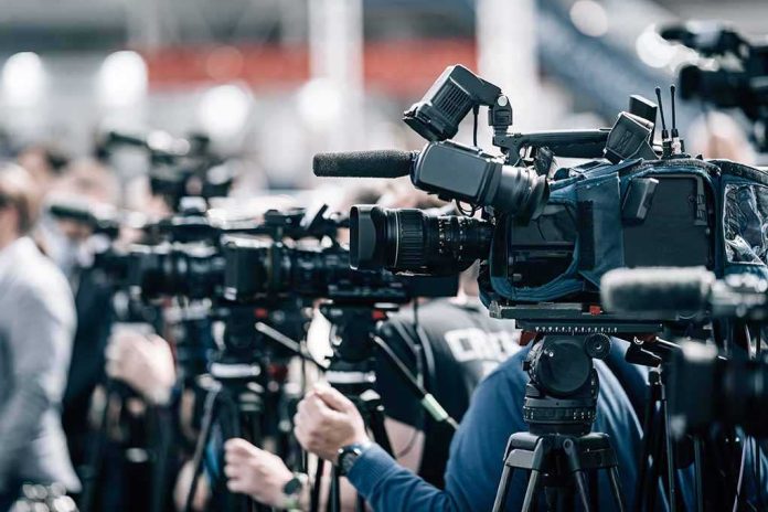 shutterstock_2197858977 Broadcast cameras on tripods at a press event