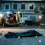 Decades-Old Cold Case Victim Finally Identified crime scene with body bag in alley