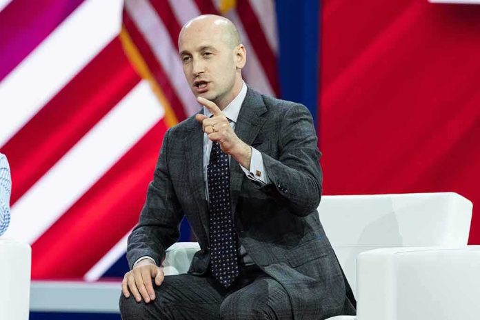 Stephen Miller speaking on stage during a panel discussion