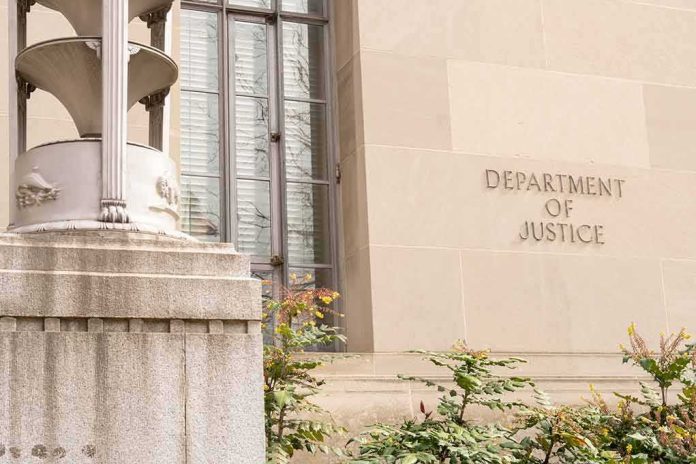 shutterstock_2271133921-1 Department of Justice building facade with stone sign and window