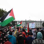 Eurovision 2026 CHAOS: Five Nations BOYCOTT Israel! Crowd holding flags and signs outside a fenced government building