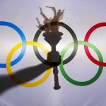 olympic rings with torch shadow