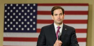 Dual National Security Role Made Permanent man in suit speaking into a microphone