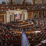 Capitol Hearing Halted Over Message Shirts Legislative chamber filled with attendees during a formal address