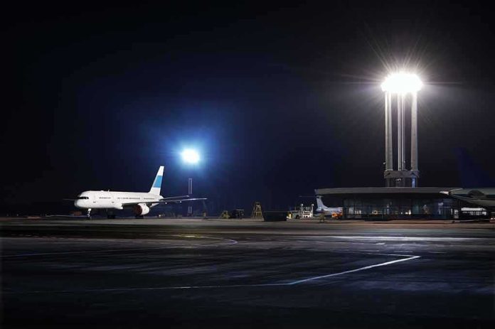 shutterstock_49683088 Airliner on a dimly lit airport tarmac at night