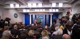 Trump Cancels $810M in Approved Funds Press secretary at podium addressing reporters in briefing room