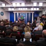 New Acting Intelligence Chief Sparks Controversy Press secretary at podium addressing reporters in briefing room