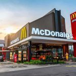 2,500-Mile Journey Ends in Theft McDonald's restaurant exterior with drive-thru at sunset