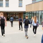 French Students Block Hundreds of Schools Students with backpacks walking toward a school entrance