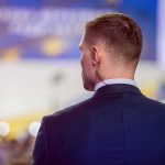 Man in suit with earpiece at event
