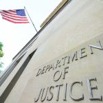 Department of Justice building with American flag