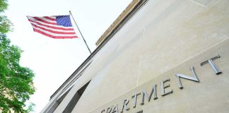 Agents Tracked Calls, Travel in Trump Probe Department of Justice building with American flag